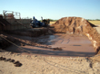 Sump pit to collect drill cuttings from shaker table