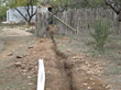 Trench for PVC pipe between the pump house (background) and the seed-cleaning plant (not pictured).