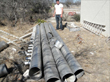 Irrigation metal pipes that were cut in half (lengthwise) and used as gutters to channel rainwater to downspouts.