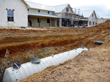 View of the buried 15,000-gallon tank during installation.