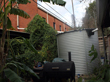 3,000-gallon tank at the back of the house. It collects water from the church roof next door.