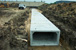 Close-up view of culverts being buried