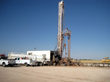 West Texas Water Well Services' drill rig and ancillary vehicles