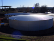 Top of the galvanized tanks. The swimming pool at the Center is located in the background.