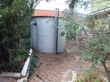 Another view of the tank at the front of the house with the air gap.